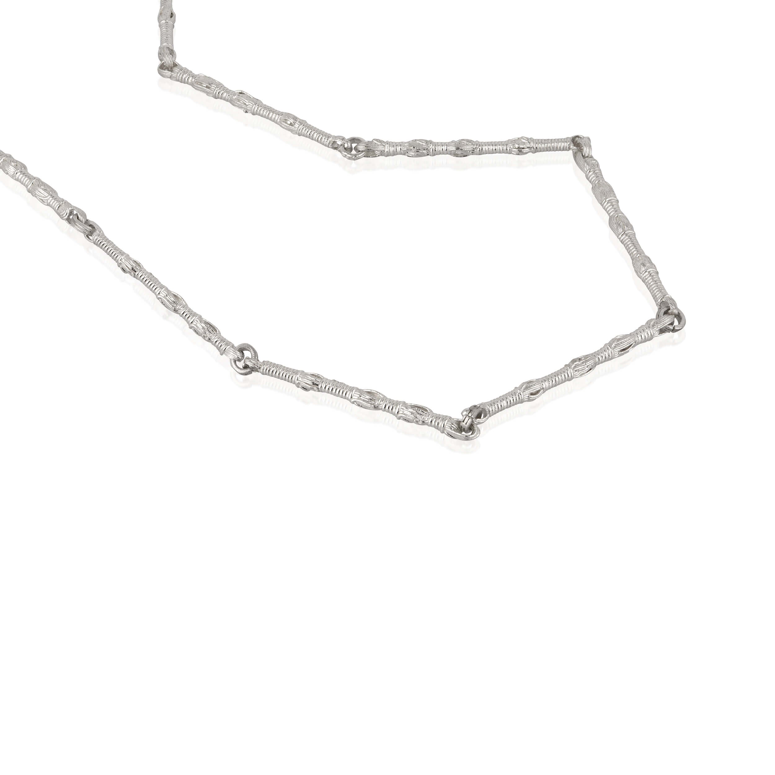 Detail Shot of Tallisman I Necklace №1 in Sterling Silver on white background with soft shadow — Ashkenazi Tzitzit-inspired Jewish jewelry and Judaica, handcrafted in Israel