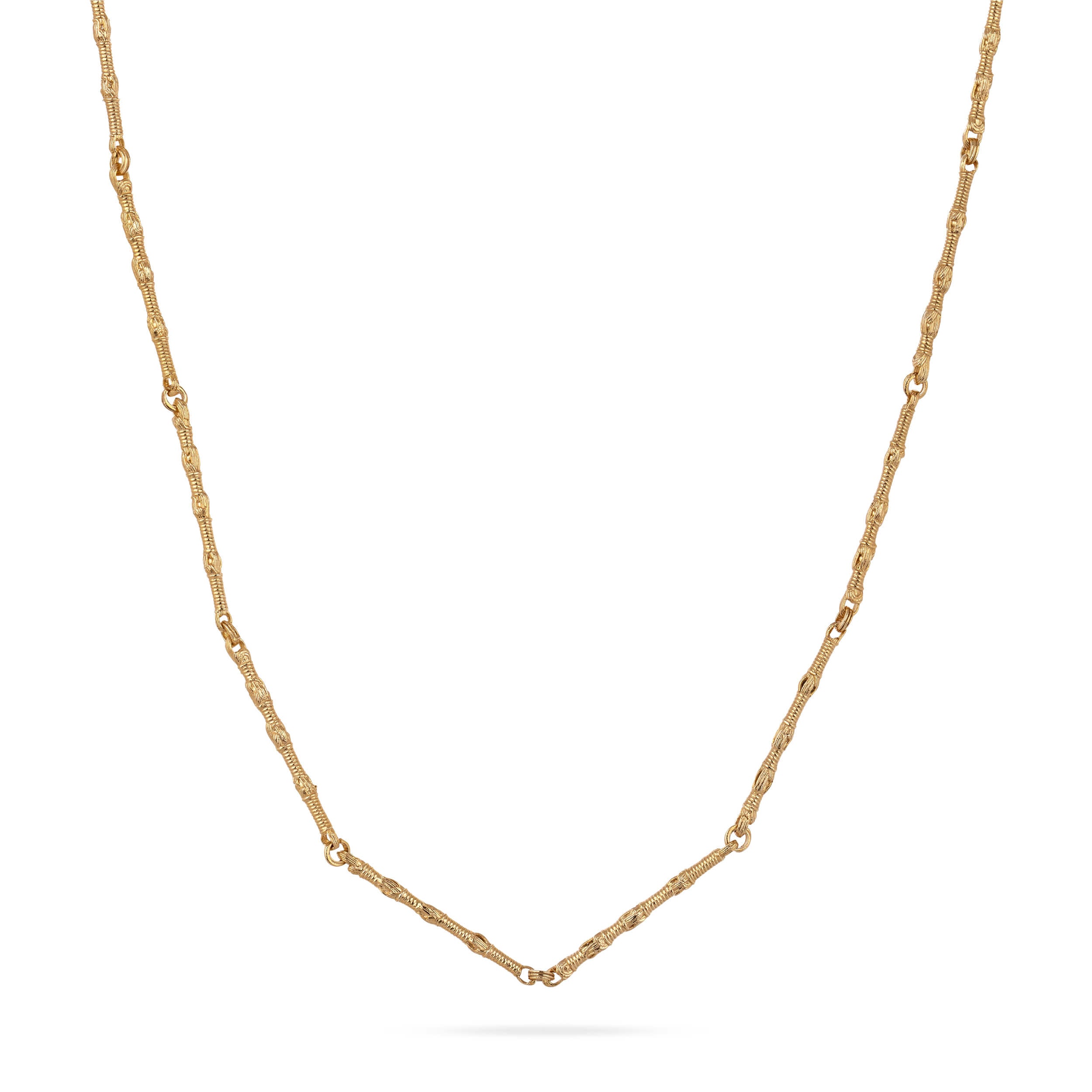 A structural drape shot of the Breindell Tzitzit I Necklace №1 in 14K gold. The composition highlights the fluid architectural geometry and high-lustre finish of the integrated chain and knot, presented on a minimalist white background with a clean, soft shadow.