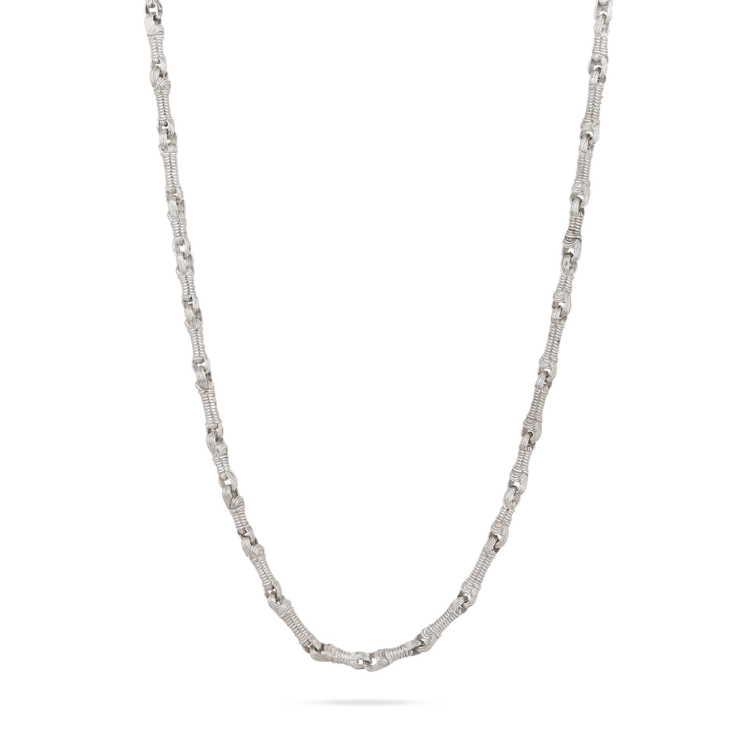 A structural drape shot of the Breindell Tzitzit I Necklace №2 in 925 sterling silver. The composition showcases the fluid architectural geometry and material weight of the integrated chain and knot, presented on a minimalist white background with a clean, soft shadow.