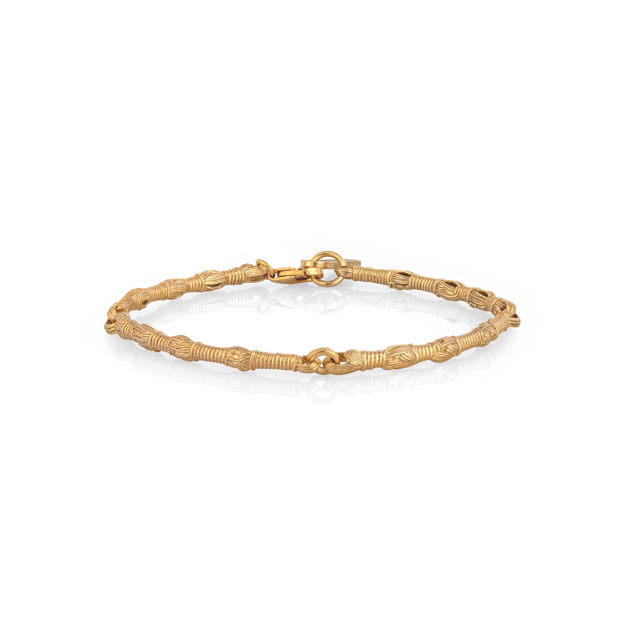 Side View of Tallisman I Bracelet №1 in 14K gold on white background with soft shadow — Ashkenazi Tzitzit-inspired Jewish jewelry and Judaica, handcrafted in Israel