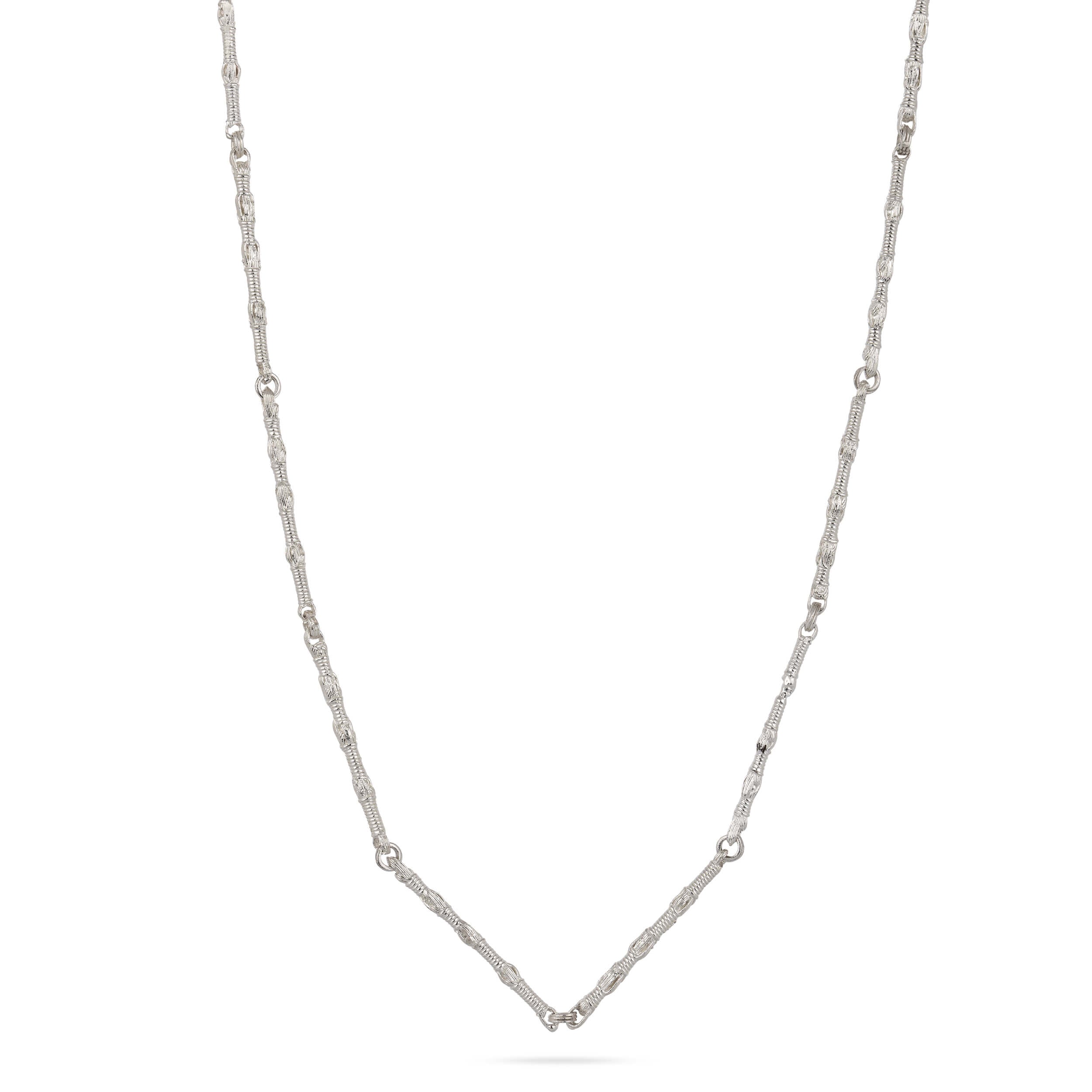 A structural drape shot of the Breindell Tzitzit I Necklace №1 in 925 sterling silver. The composition showcases the fluid geometry and architectural weight of the integrated chain and knot against a minimalist white background with a soft, clean shadow.